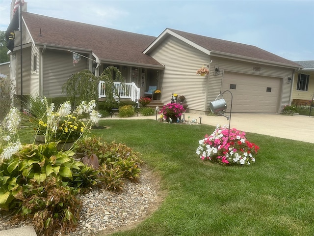 exterior space featuring a front lawn, a porch, and a garage