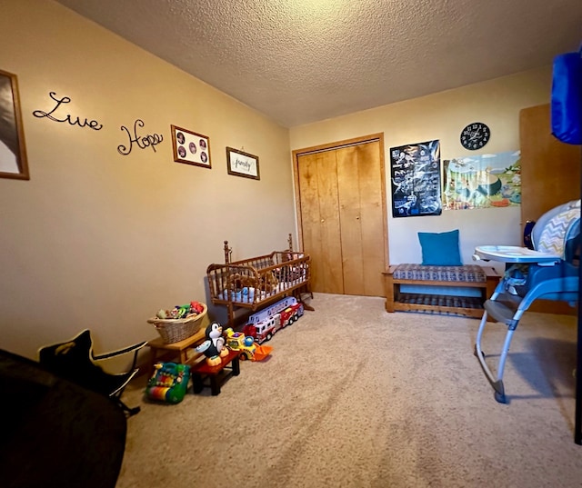 game room with carpet and a textured ceiling