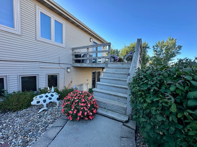 rear view of property featuring a balcony