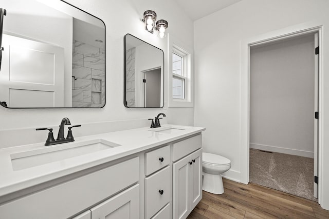 bathroom featuring hardwood / wood-style floors, vanity, and toilet