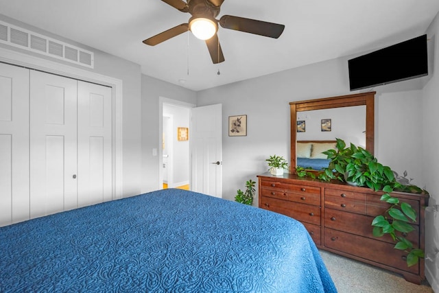 bedroom featuring ceiling fan and a closet