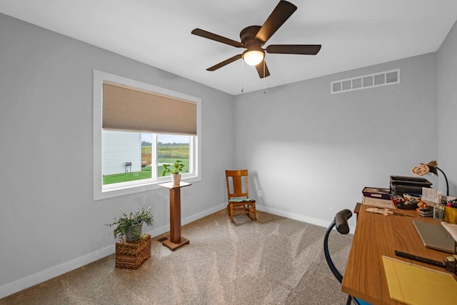 office space featuring ceiling fan and carpet floors