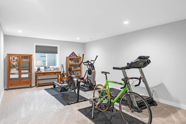 exercise room with light carpet