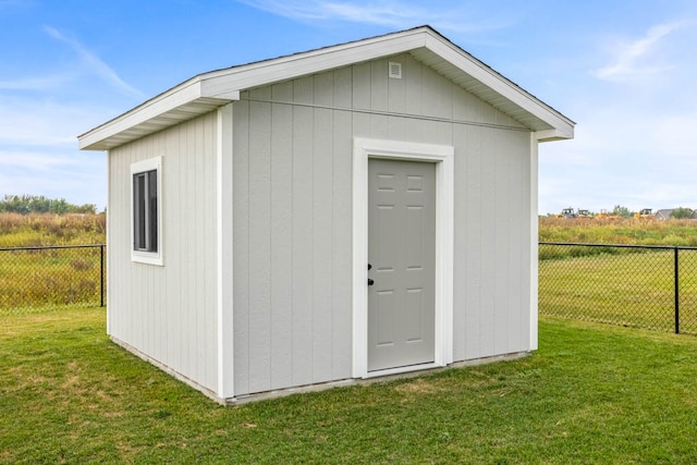 view of outdoor structure with a lawn