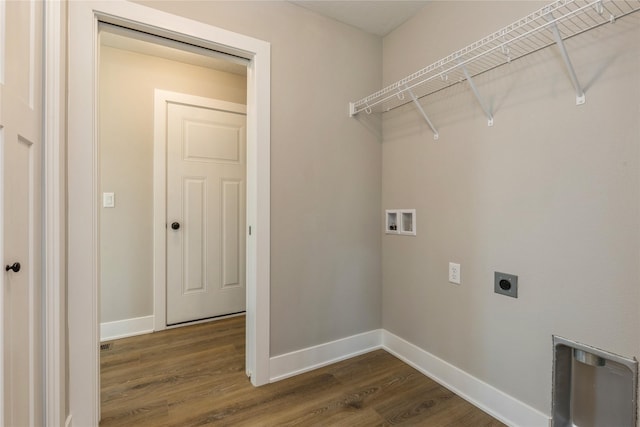 laundry area with washer hookup, electric dryer hookup, and dark wood-type flooring