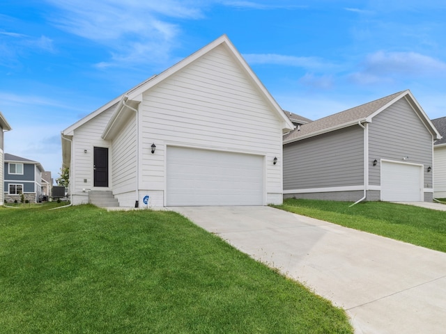 view of front of home featuring a garage and a front yard