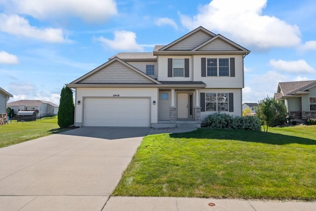 craftsman inspired home with a garage, driveway, and a front yard