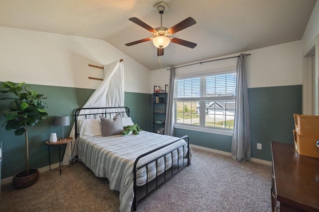 bedroom with ceiling fan, carpet, baseboards, and vaulted ceiling