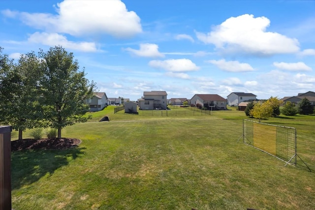 view of yard with fence and a residential view