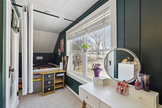 rec room with vaulted ceiling, light colored carpet, and a healthy amount of sunlight