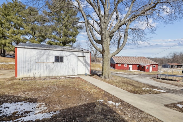 view of yard featuring a trampoline and an outbuilding