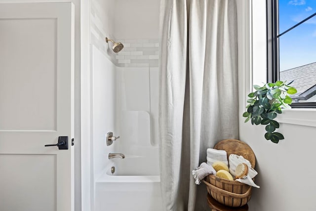 bathroom featuring shower / bath combo with shower curtain