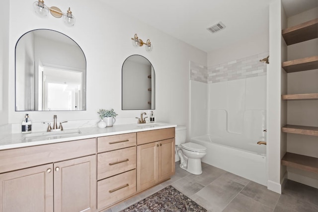 full bathroom featuring vanity, toilet, and tiled shower / bath