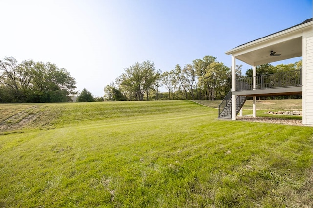 view of yard with ceiling fan