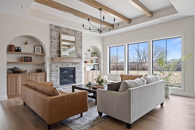 living room featuring hardwood / wood-style floors, a fireplace, and a wealth of natural light