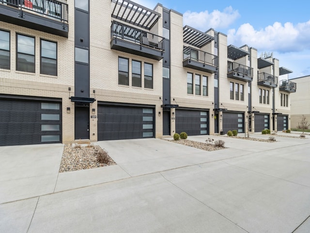 exterior space featuring a balcony and a garage