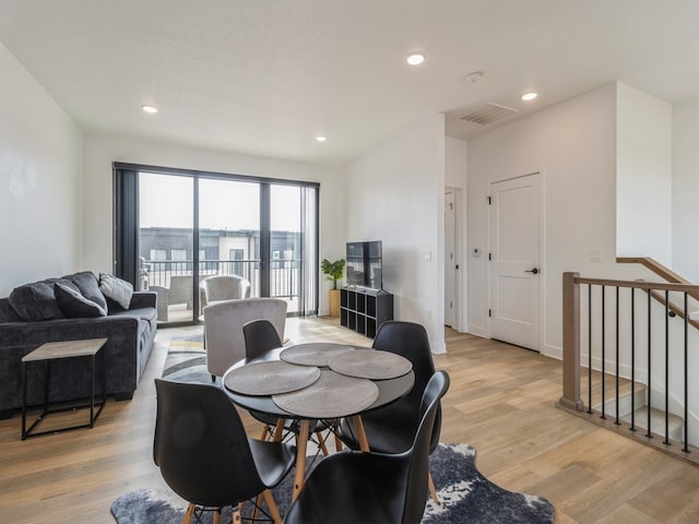 dining room with visible vents, recessed lighting, light wood-type flooring, and baseboards