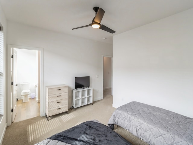 bedroom featuring light carpet, ceiling fan, and baseboards