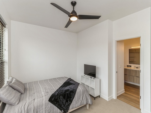 carpeted bedroom featuring baseboards and ceiling fan