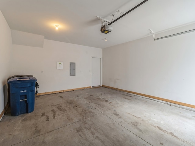 garage featuring electric panel, baseboards, and a garage door opener