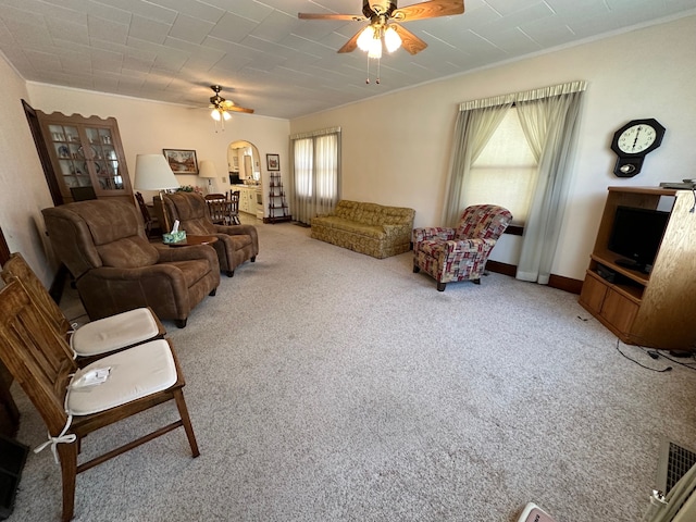 living room featuring ceiling fan and carpet floors