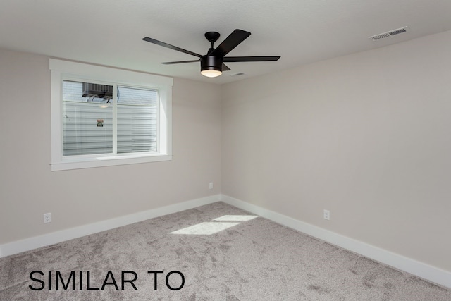 spare room with ceiling fan and carpet floors