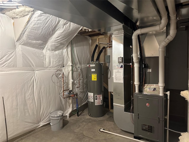 utility room featuring water heater