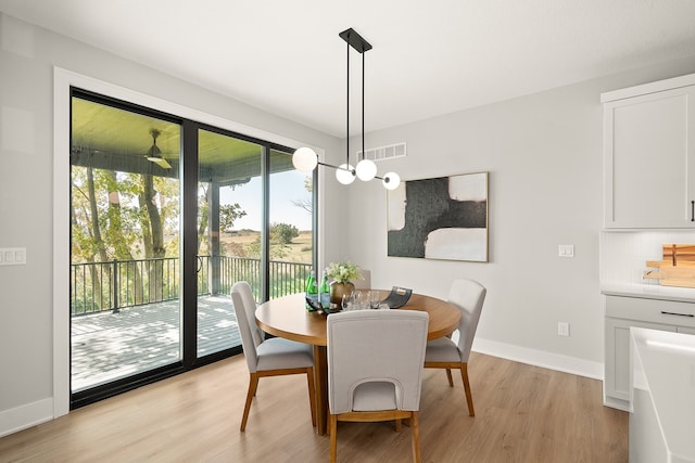 dining area with light hardwood / wood-style floors