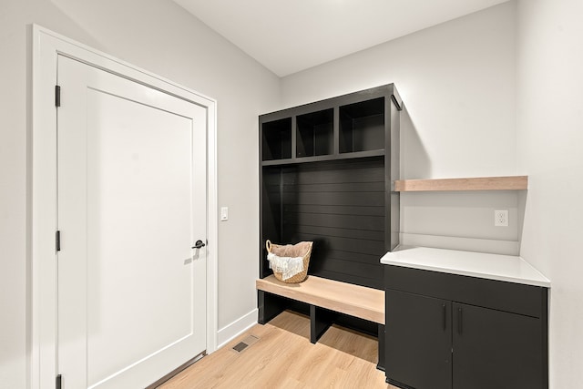 mudroom with light hardwood / wood-style flooring