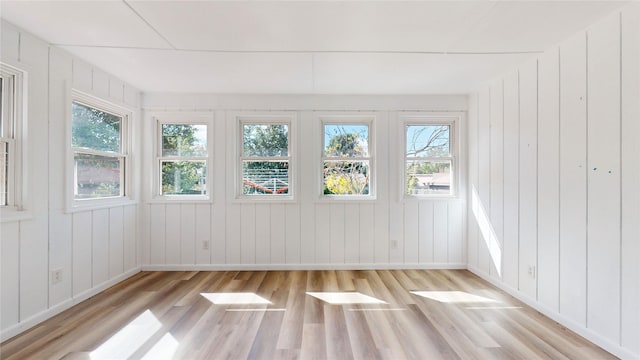 unfurnished sunroom with a wealth of natural light