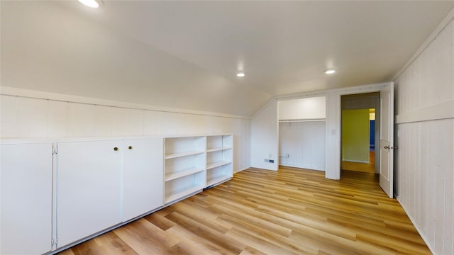 bonus room with vaulted ceiling, light wood-style flooring, and recessed lighting