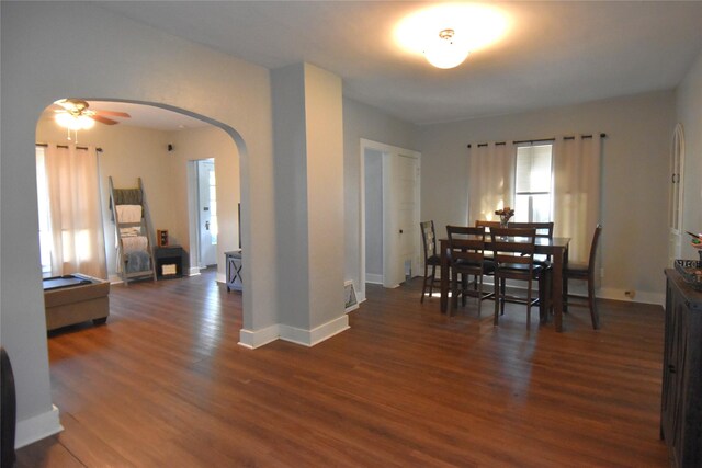 dining space with ceiling fan and dark hardwood / wood-style floors