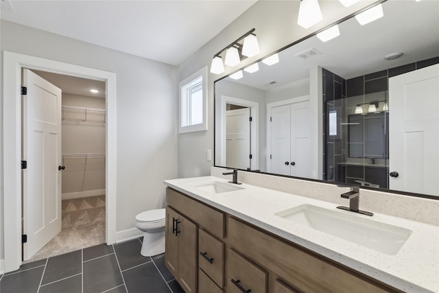 bathroom featuring tile patterned floors, vanity, and toilet