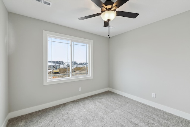 spare room with carpet flooring and ceiling fan