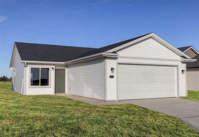 single story home featuring a garage and a front lawn