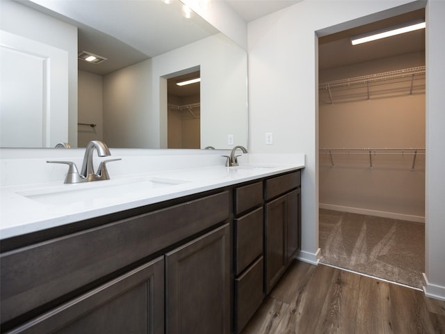 bathroom featuring vanity and hardwood / wood-style floors