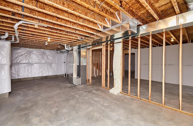 basement featuring heating unit