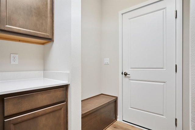 mudroom with light hardwood / wood-style floors