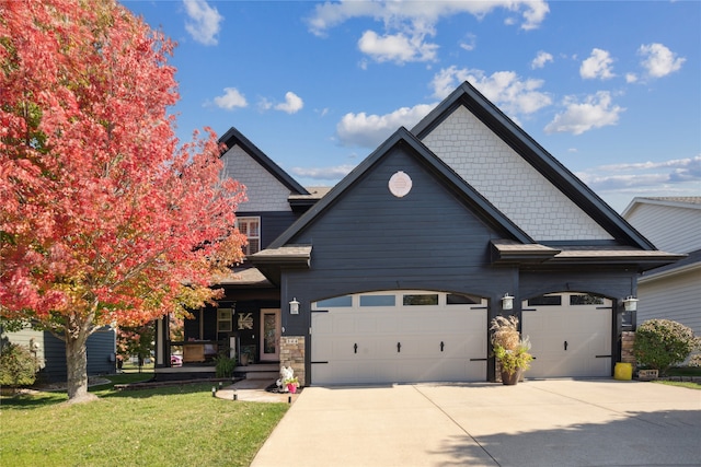 view of front facade with a front yard and a garage