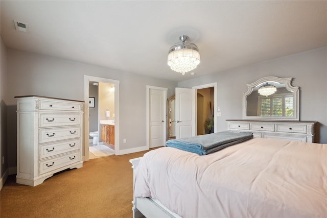 bedroom featuring a notable chandelier, visible vents, light carpet, connected bathroom, and baseboards