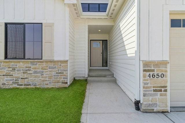 view of exterior entry featuring a garage