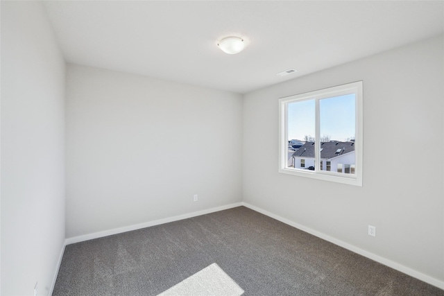 spare room featuring carpet flooring