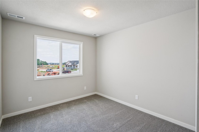 904 Spruce Ave, Norwalk, IA 50211 - spare room with carpet flooring, baseboards, and a textured ceiling