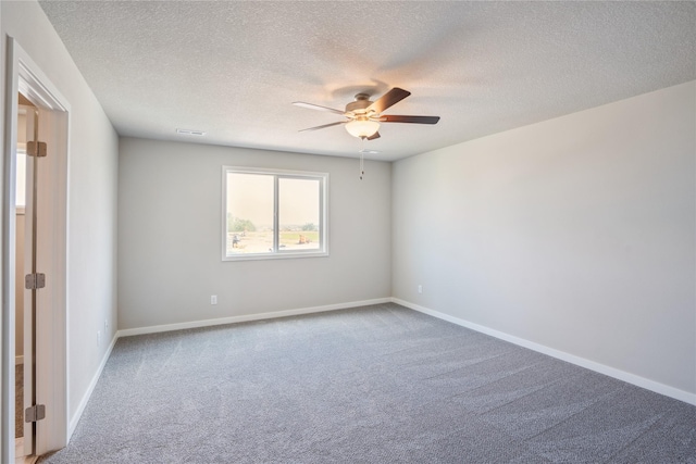 904 Spruce Ave, Norwalk, IA 50211 - carpeted empty room with ceiling fan, a textured ceiling, and baseboards