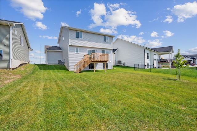 904 Spruce Ave, Norwalk, IA 50211 - back of house featuring stairs, a deck, and central air condition unit