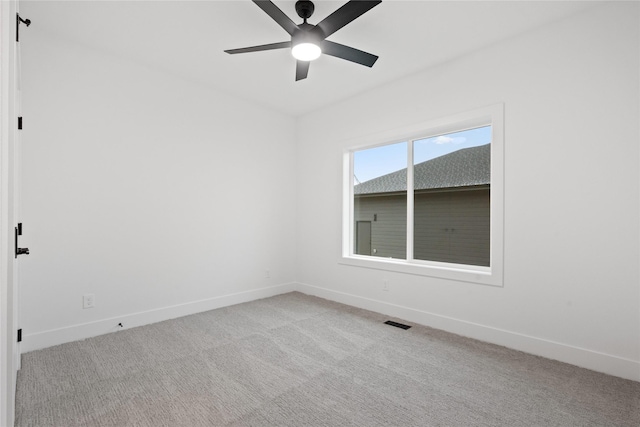 unfurnished room with light carpet and ceiling fan