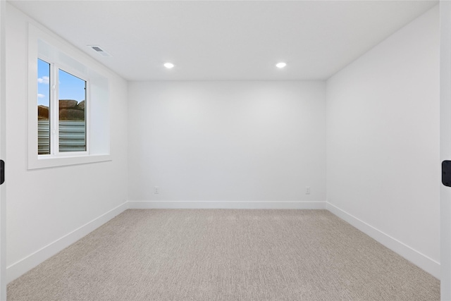 unfurnished room featuring carpet