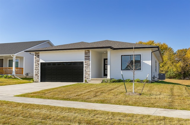 view of front of home featuring a porch, a front lawn, central AC unit, and a garage