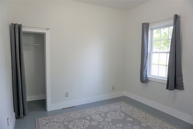 unfurnished bedroom with a closet