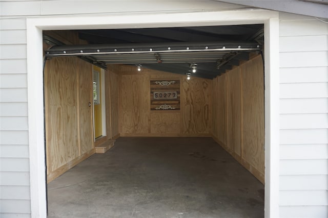 interior space featuring wood walls